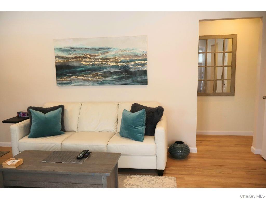 38 Woodridge Road Hampton Bays, NY 11946 - Photo 6 of 24 a bedroom with a bed and a window