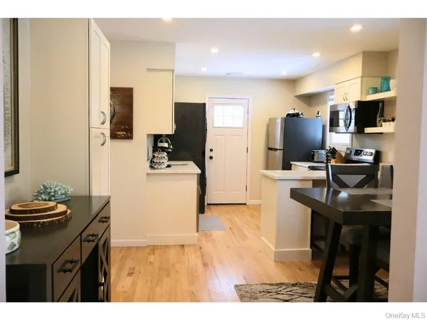 a kitchen with a sink appliances and cabinets