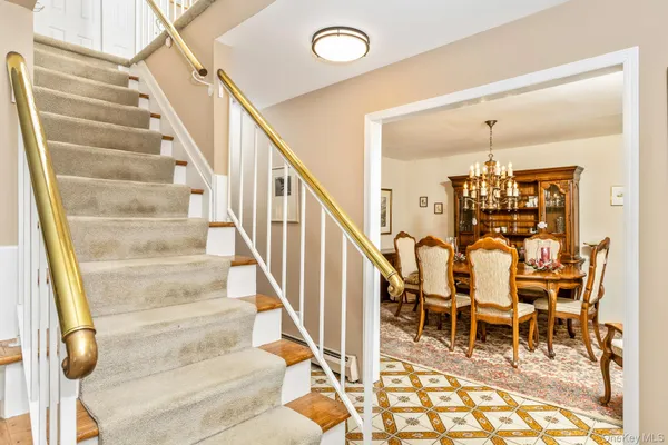 a view of entryway and hall with dining room view