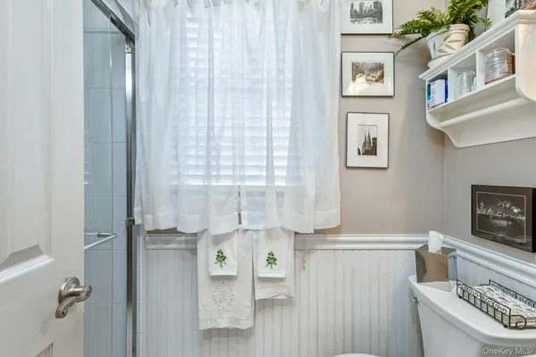 a bathroom with a toilet and shower