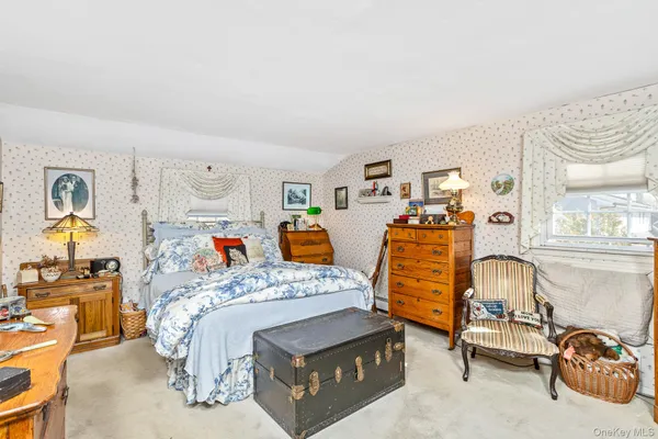 a bedroom with furniture and a bed