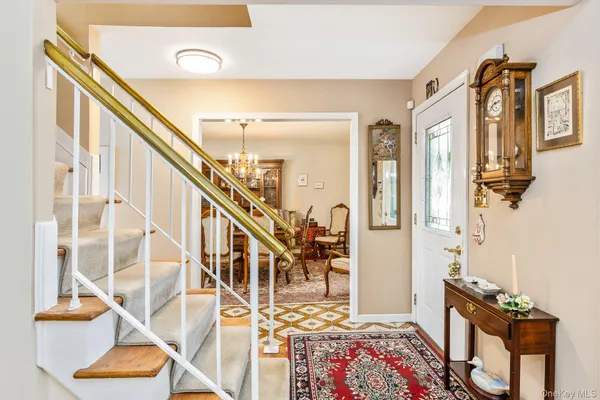 a view of an entryway with wooden floor