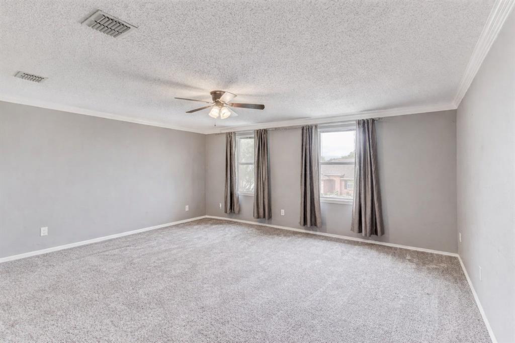 3601 McClintick Road McKinney, TX 75070 - Photo 16 of 24 a view of an empty room with a chandelier fan