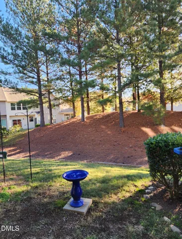 a view of a yard with swimming pool