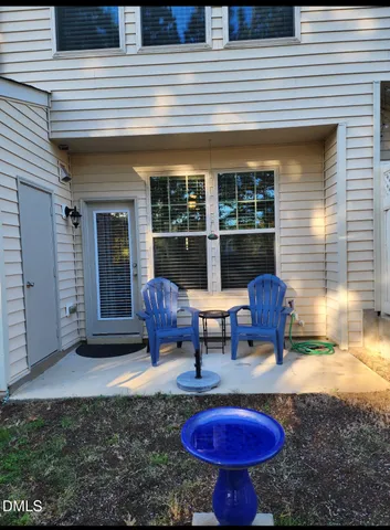 a view of a chairs and table in the patio