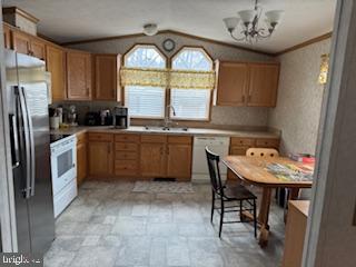196 Lake Drive Media, PA 19063 - Photo 14 of 42 a kitchen with stainless steel appliances granite countertop a sink a stove a refrigerator with a dining table and chairs
