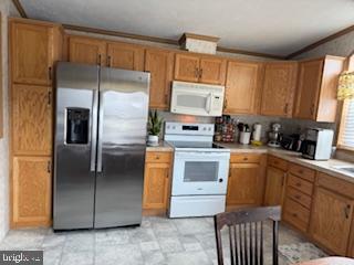 196 Lake Drive Media, PA 19063 - Photo 15 of 42 a kitchen with stainless steel appliances granite countertop a refrigerator a stove a sink and dishwasher