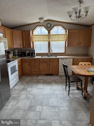 196 Lake Drive Media, PA 19063 - Photo 17 of 42 a kitchen with a stove a sink a table and chairs