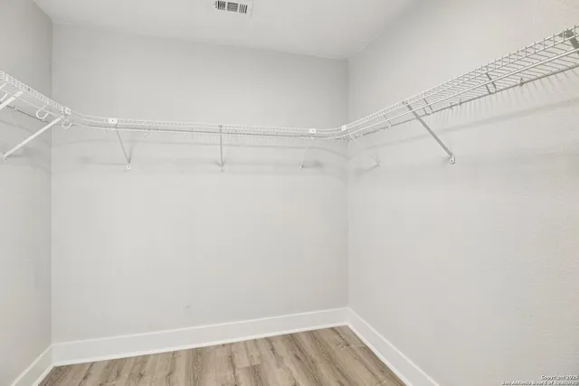 a view of a room with racks on the wall