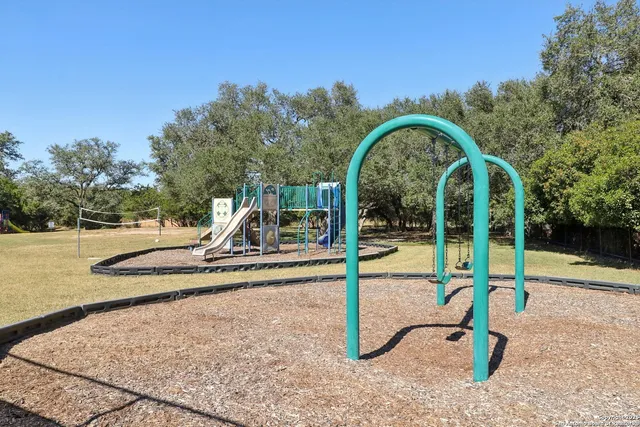 a view of a park with swings