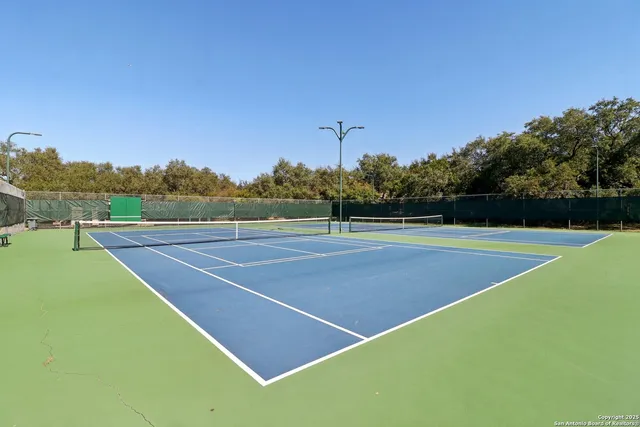 a view of an outdoor space and tennis court