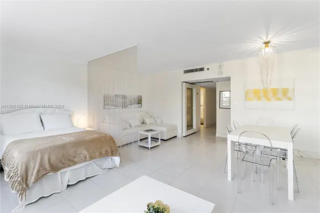 a bedroom with a bed and a table