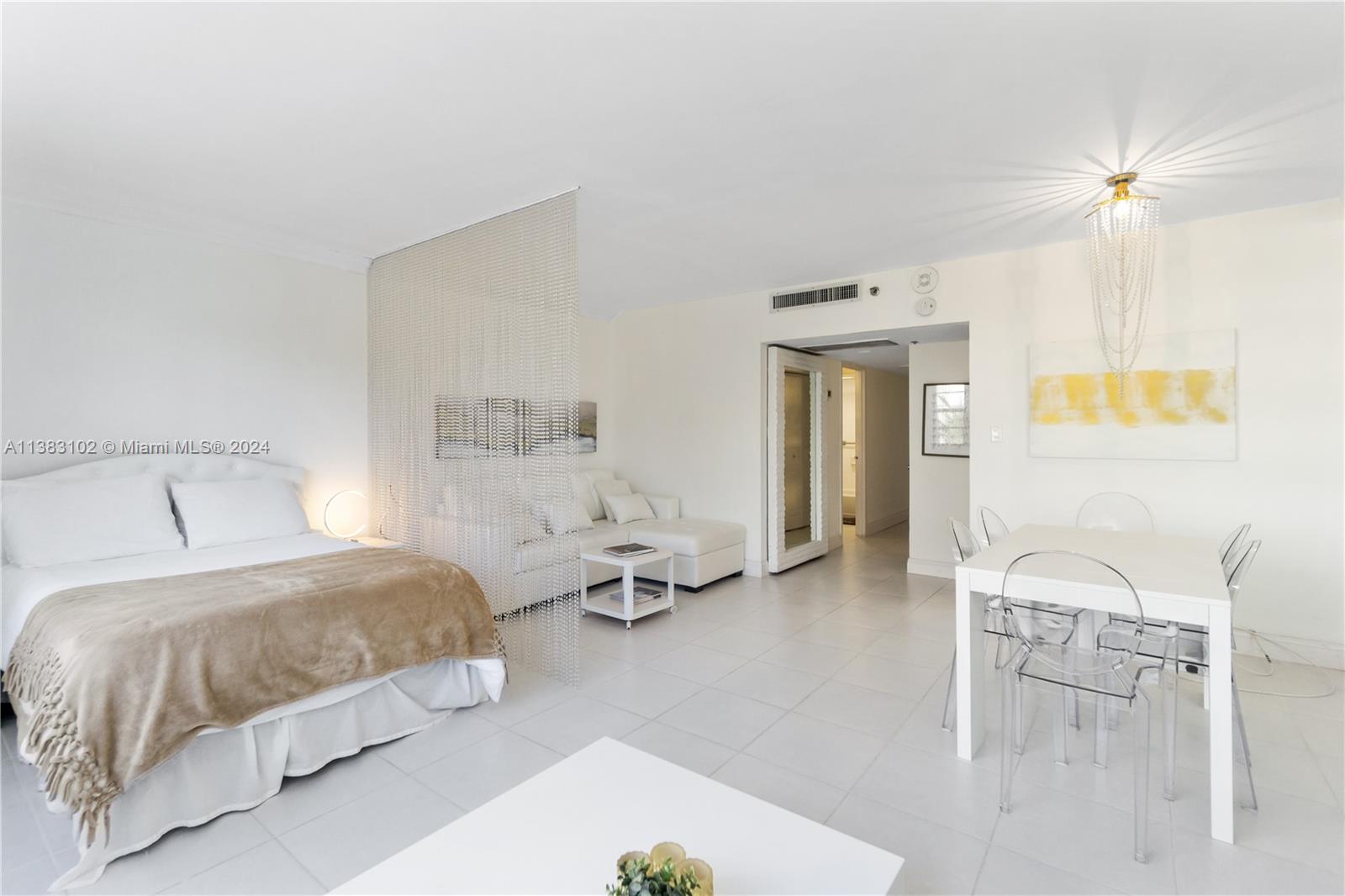 a bedroom with a bed and a table