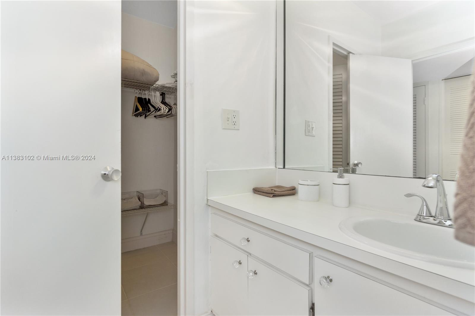 100 Lincoln Road, Unit 306 Miami Beach, FL 33139 - Photo 12 of 18 a bathroom with a sink and mirror