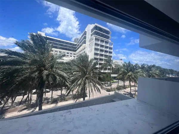 a view of swimming pool yard and outdoor seating
