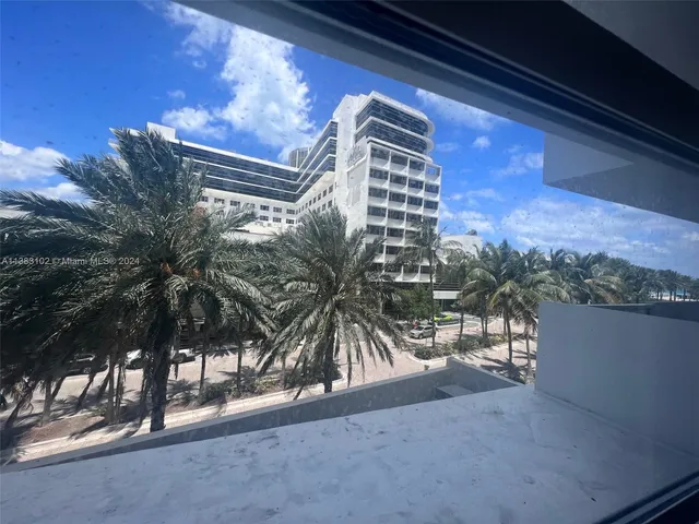 a view of swimming pool yard and outdoor seating