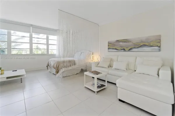 a living room with furniture and a window