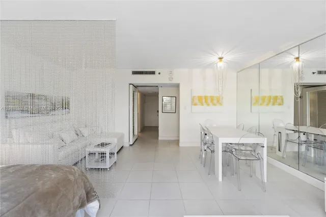 a kitchen with white cabinets and a sink