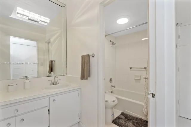 a bathroom with a bathtub and a toilet