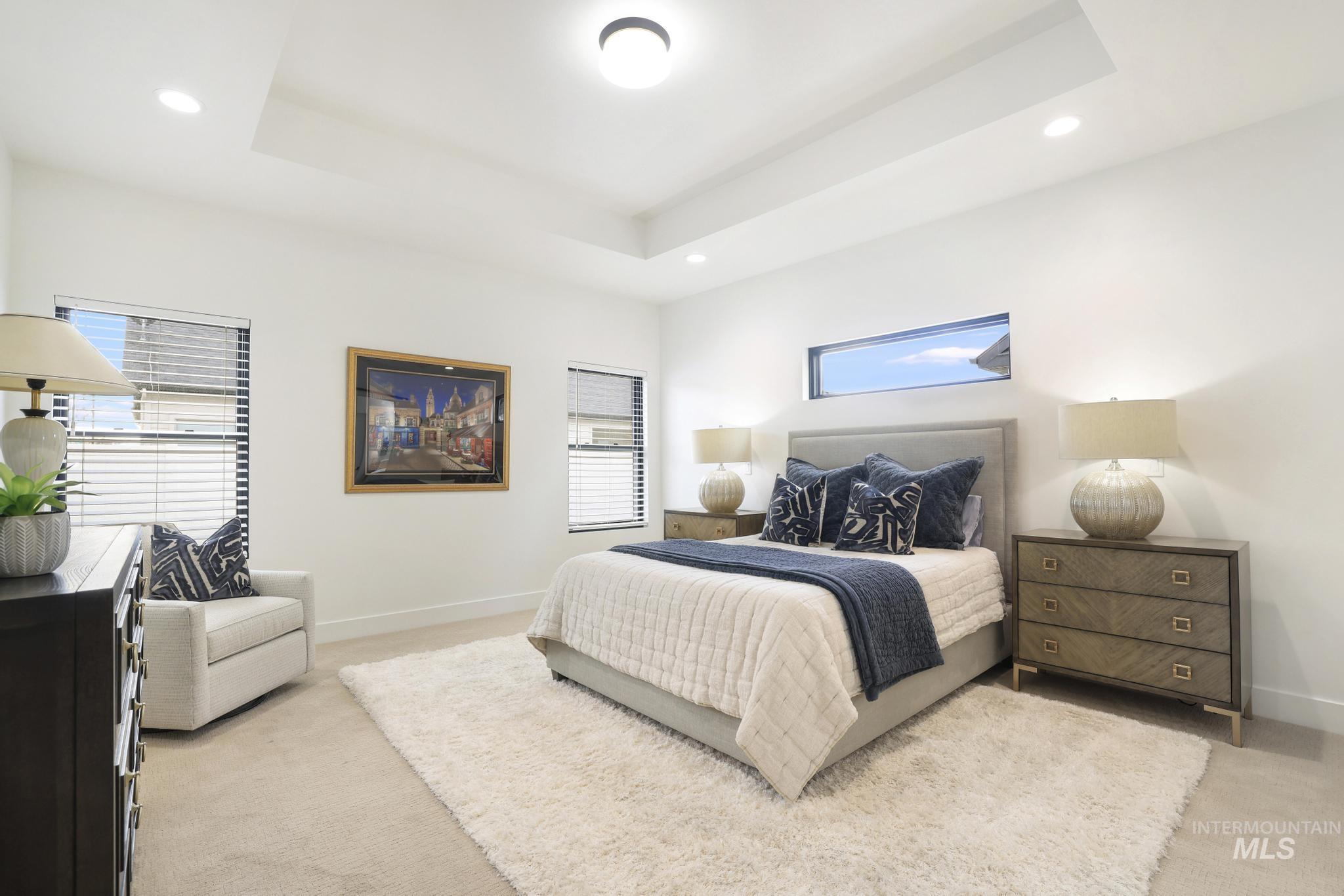 3140 Moonrise Road Twin Falls, ID 83301 - Photo 19 of 39 Bedroom with light colored carpet, recessed lighting, and a raised ceiling