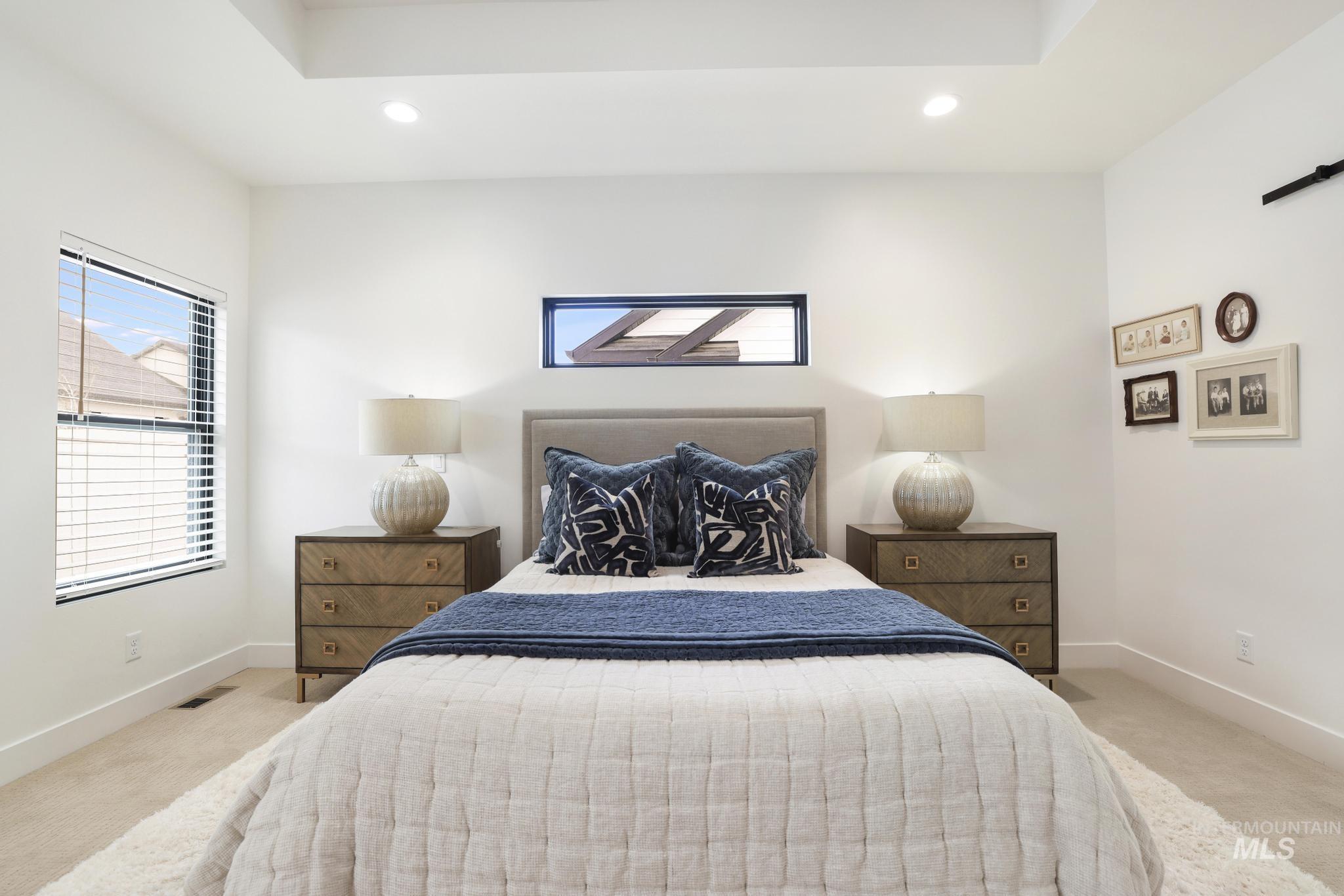 3140 Moonrise Road Twin Falls, ID 83301 - Photo 20 of 39 Bedroom featuring light carpet, recessed lighting, and multiple windows