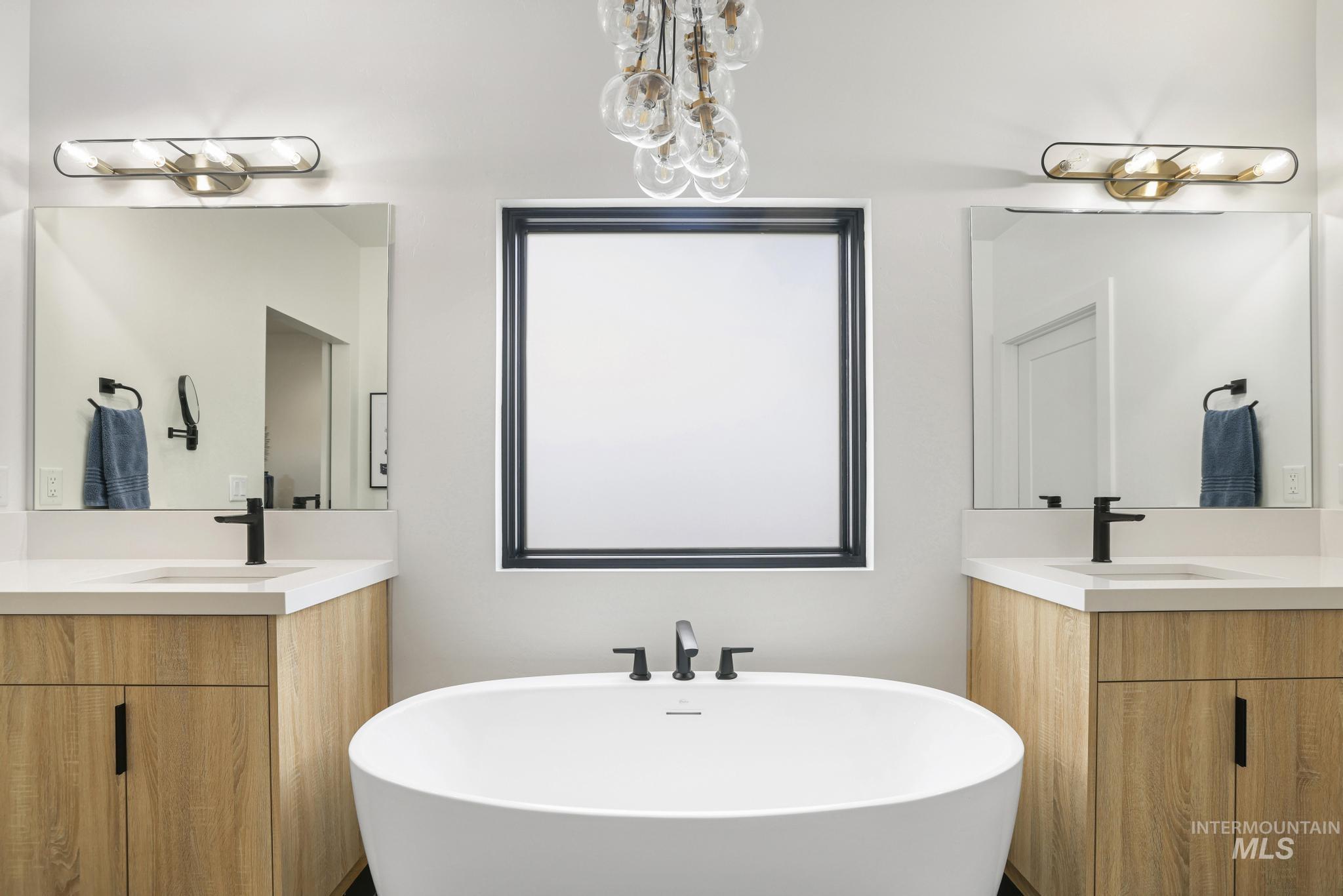 3140 Moonrise Road Twin Falls, ID 83301 - Photo 24 of 39 Full bathroom with two vanities and a freestanding bath