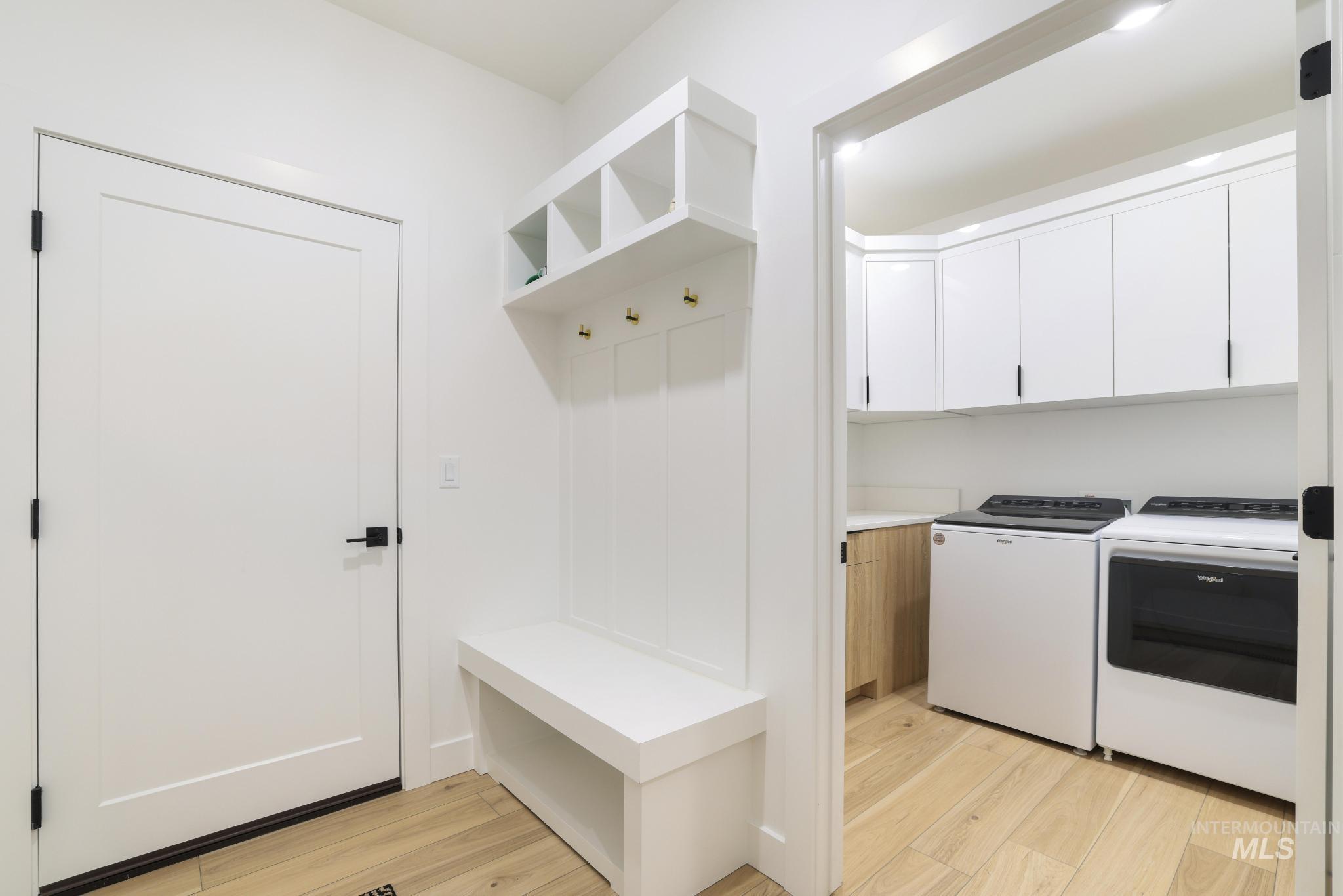 3140 Moonrise Road Twin Falls, ID 83301 - Photo 34 of 39 Mudroom featuring light wood-style floors and washing machine and dryer