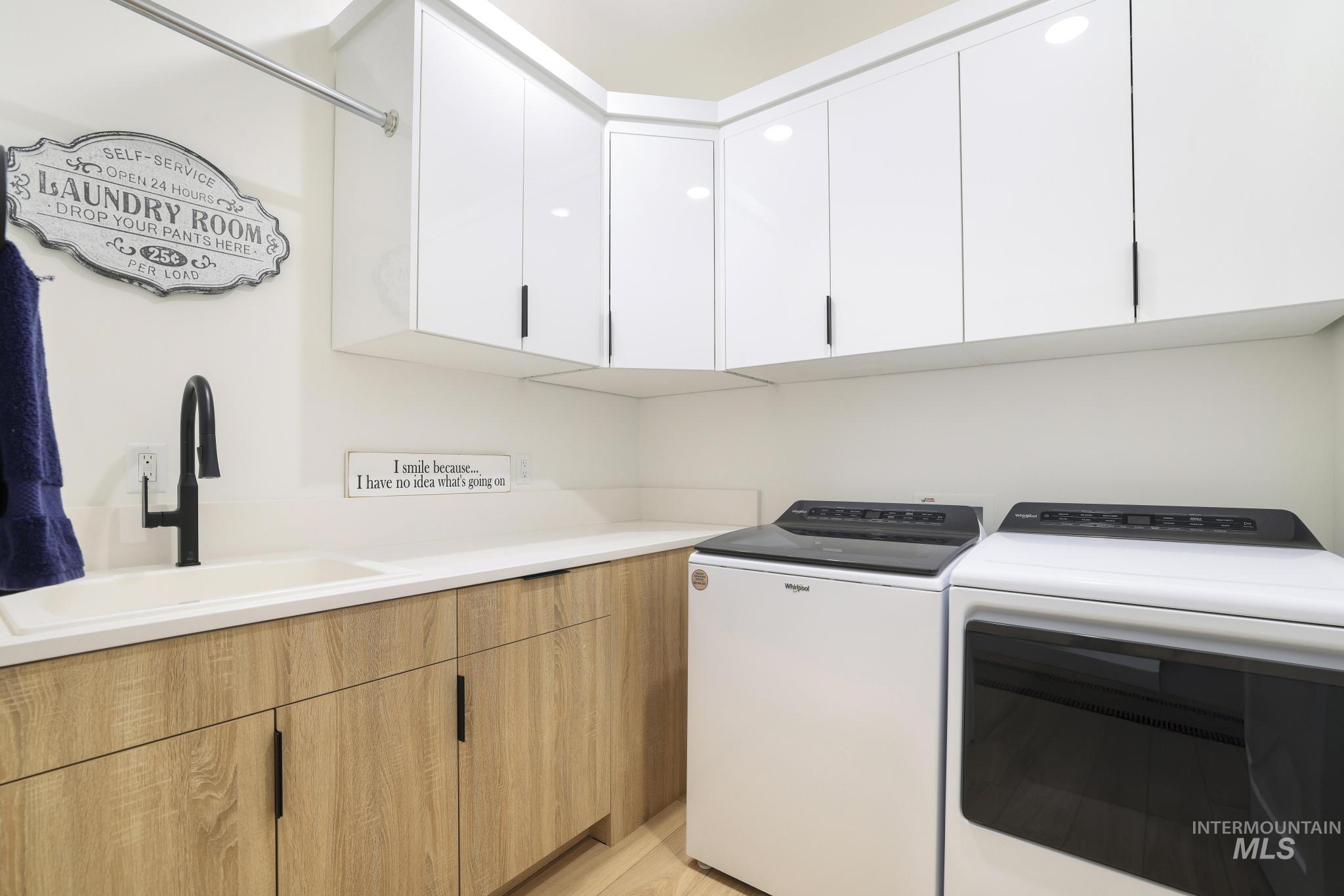 3140 Moonrise Road Twin Falls, ID 83301 - Photo 35 of 39 Laundry area featuring washer and dryer and cabinet space