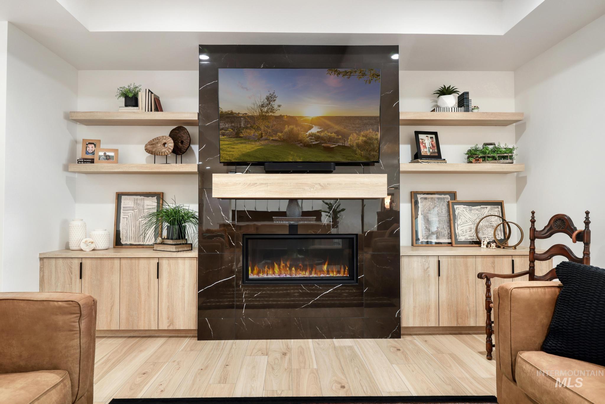 3140 Moonrise Road Twin Falls, ID 83301 - Photo 6 of 39 Living room with light wood-style floors and a fireplace