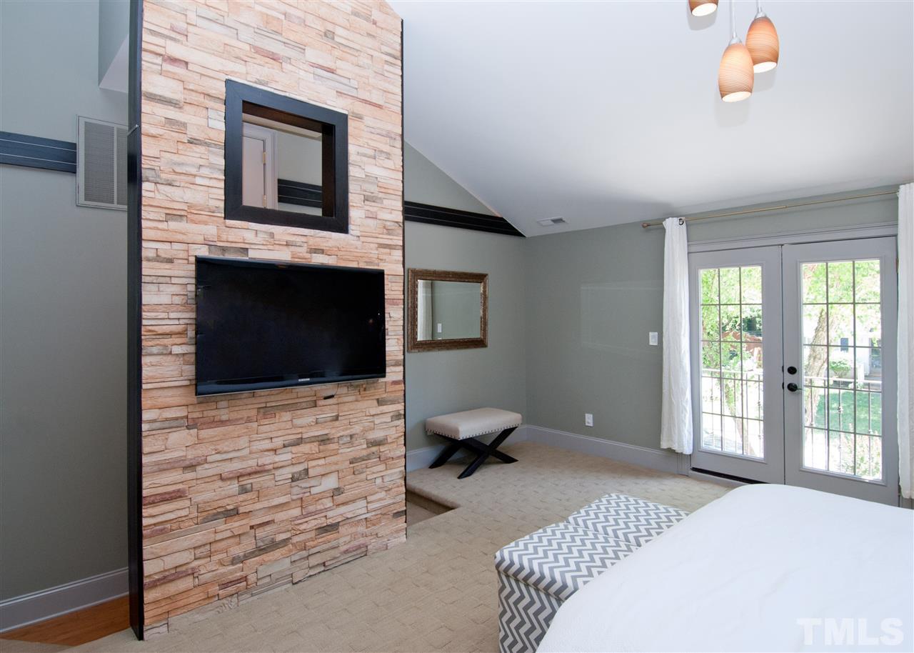 520 Smokeridge Lane Raleigh, NC 27615 - Photo 12 of 25 a bedroom with a bed and wooden floor