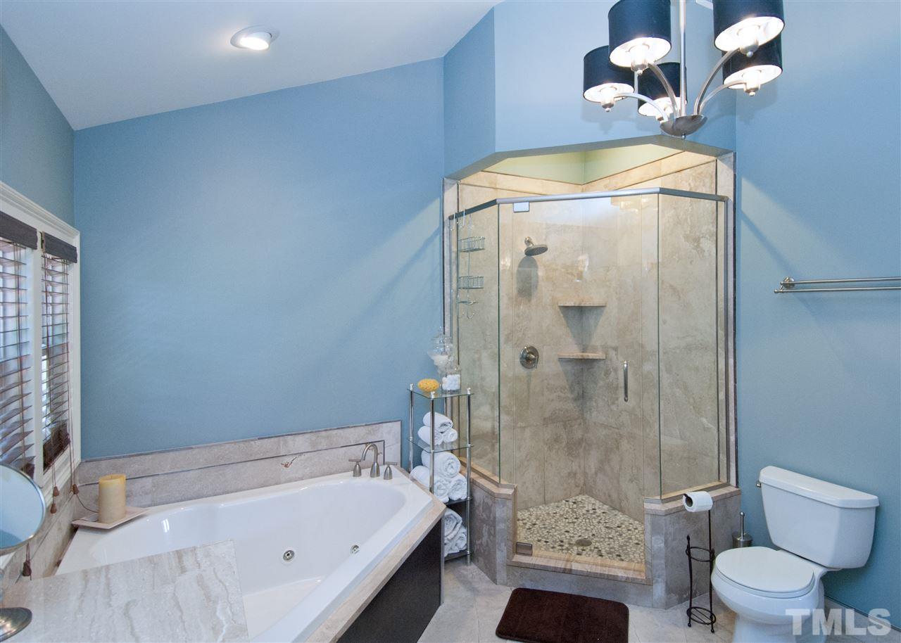 520 Smokeridge Lane Raleigh, NC 27615 - Photo 14 of 25 a bathroom with a sink a toilet and shower