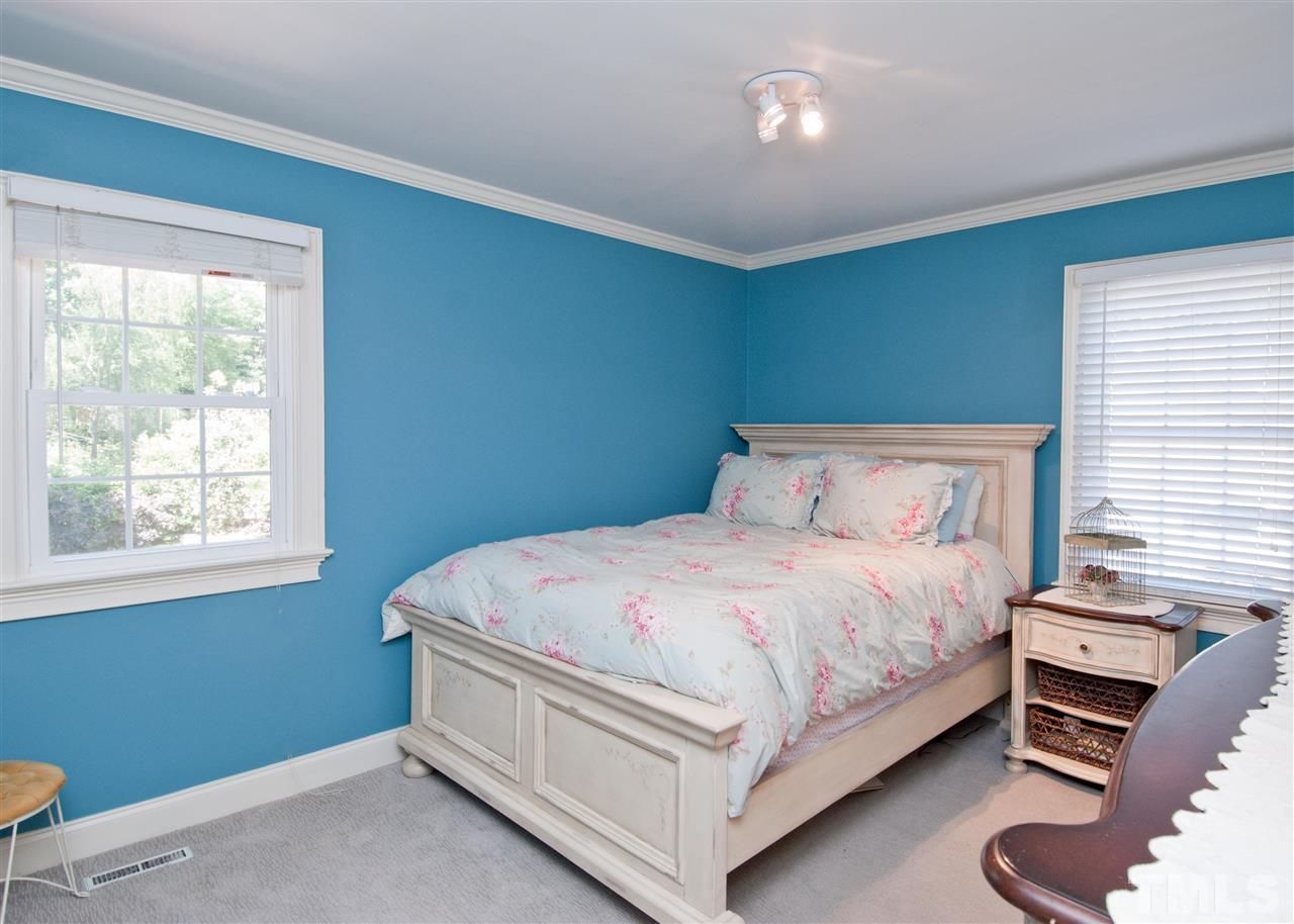 520 Smokeridge Lane Raleigh, NC 27615 - Photo 15 of 25 a bedroom with a bed and a window