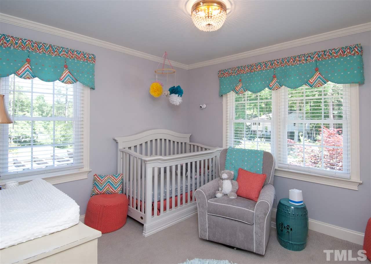 520 Smokeridge Lane Raleigh, NC 27615 - Photo 16 of 25 a bedroom with furniture and a window