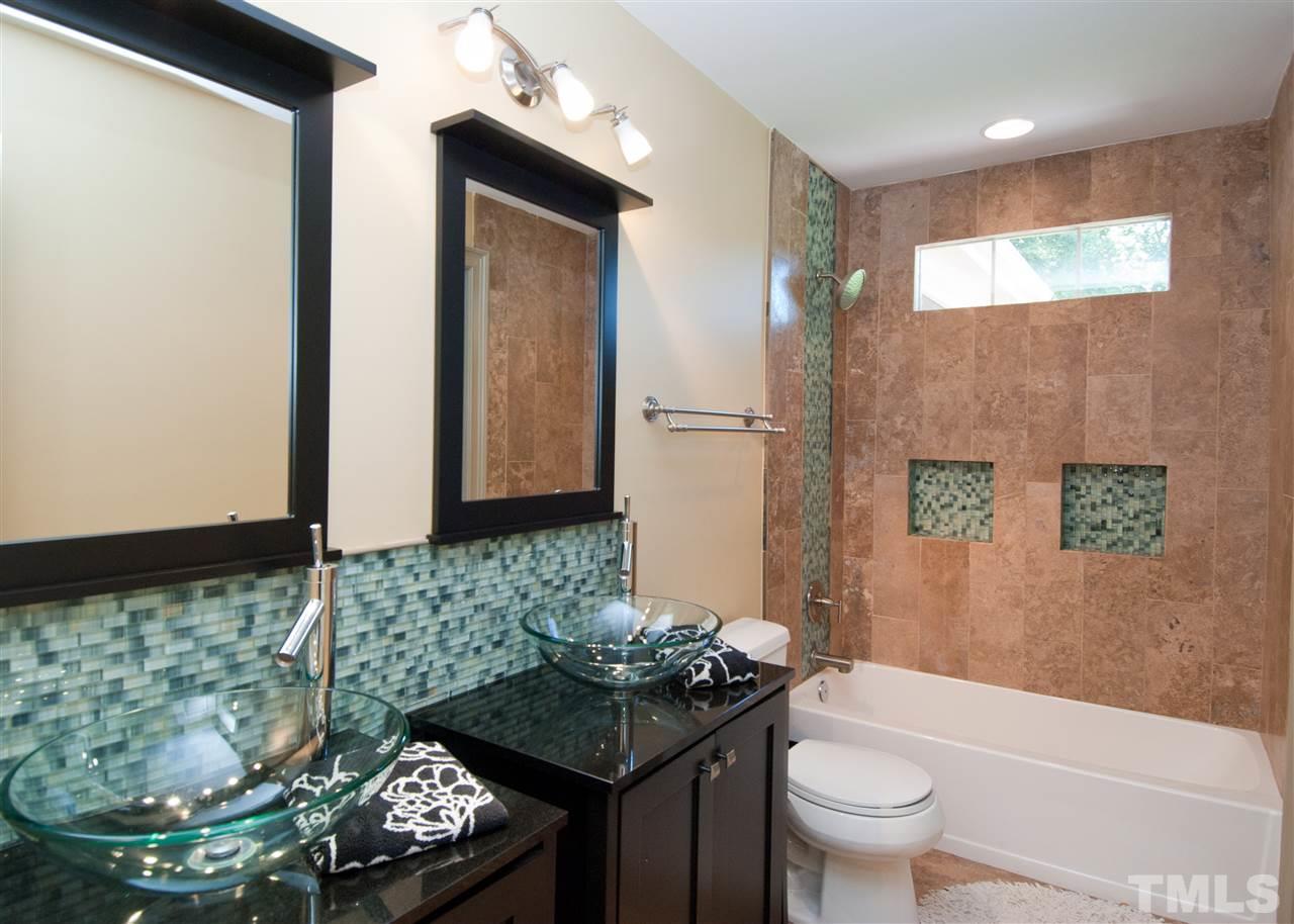 520 Smokeridge Lane Raleigh, NC 27615 - Photo 17 of 25 a bathroom with a granite countertop sink toilet and mirror