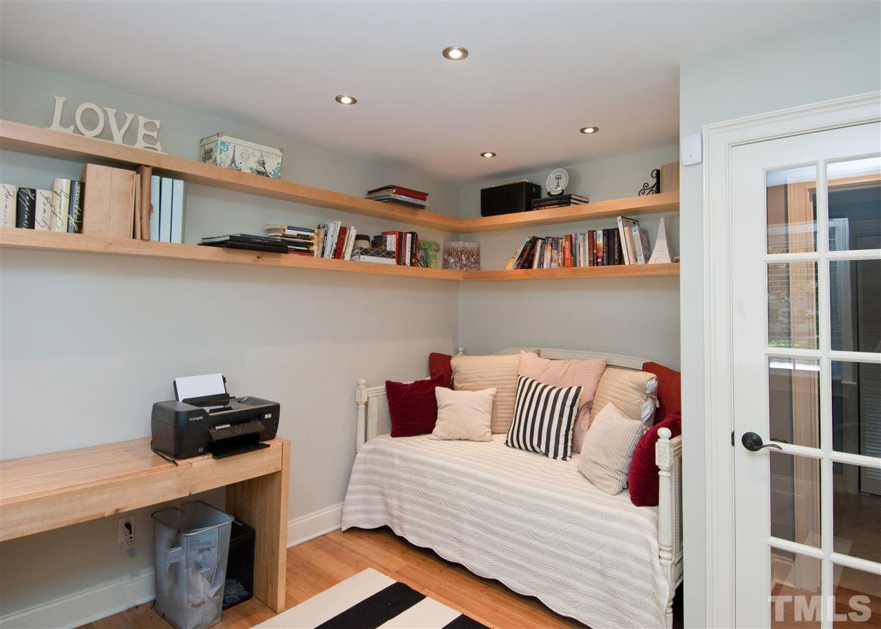 520 Smokeridge Lane Raleigh, NC 27615 - Photo 18 of 25 a bedroom with furniture and a book shelf
