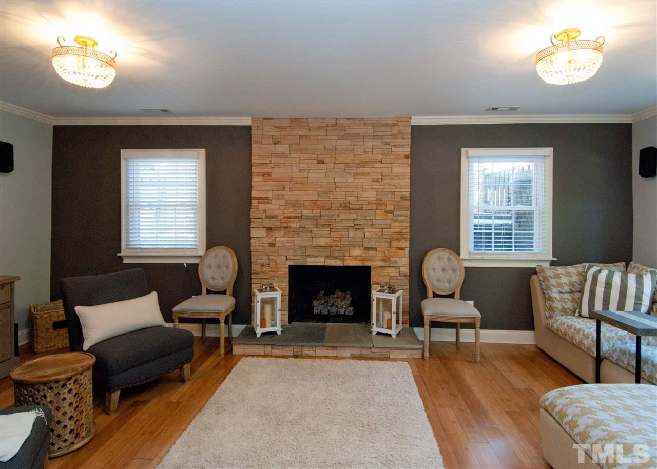 520 Smokeridge Lane Raleigh, NC 27615 - Photo 21 of 25 a living room with furniture and a fireplace