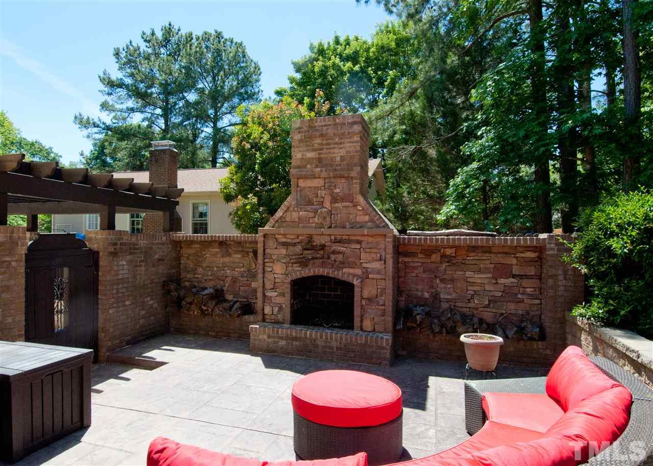 520 Smokeridge Lane Raleigh, NC 27615 - Photo 24 of 25 a view of a patio with couches table and chairs and potted plants