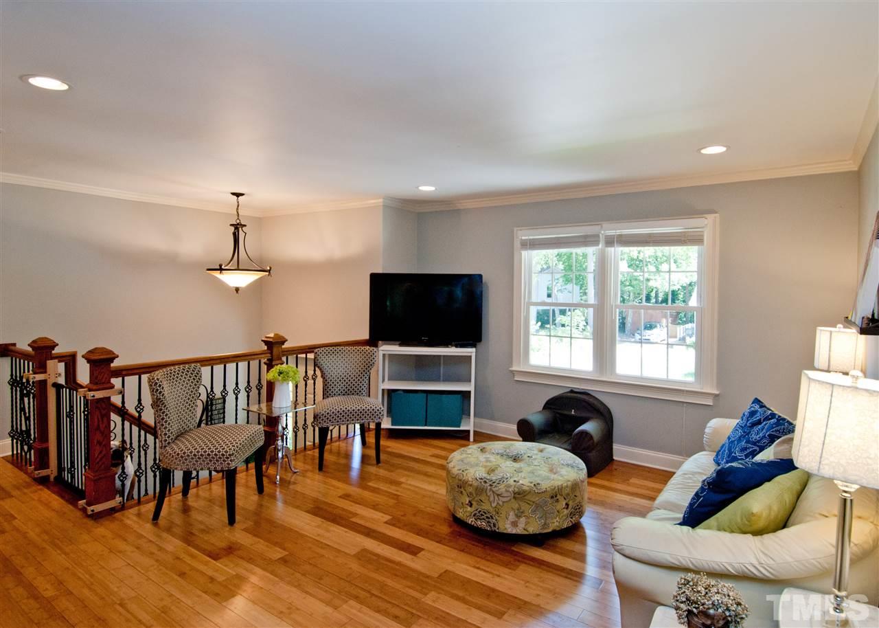 520 Smokeridge Lane Raleigh, NC 27615 - Photo 6 of 25 a living room with furniture a flat screen tv and a window