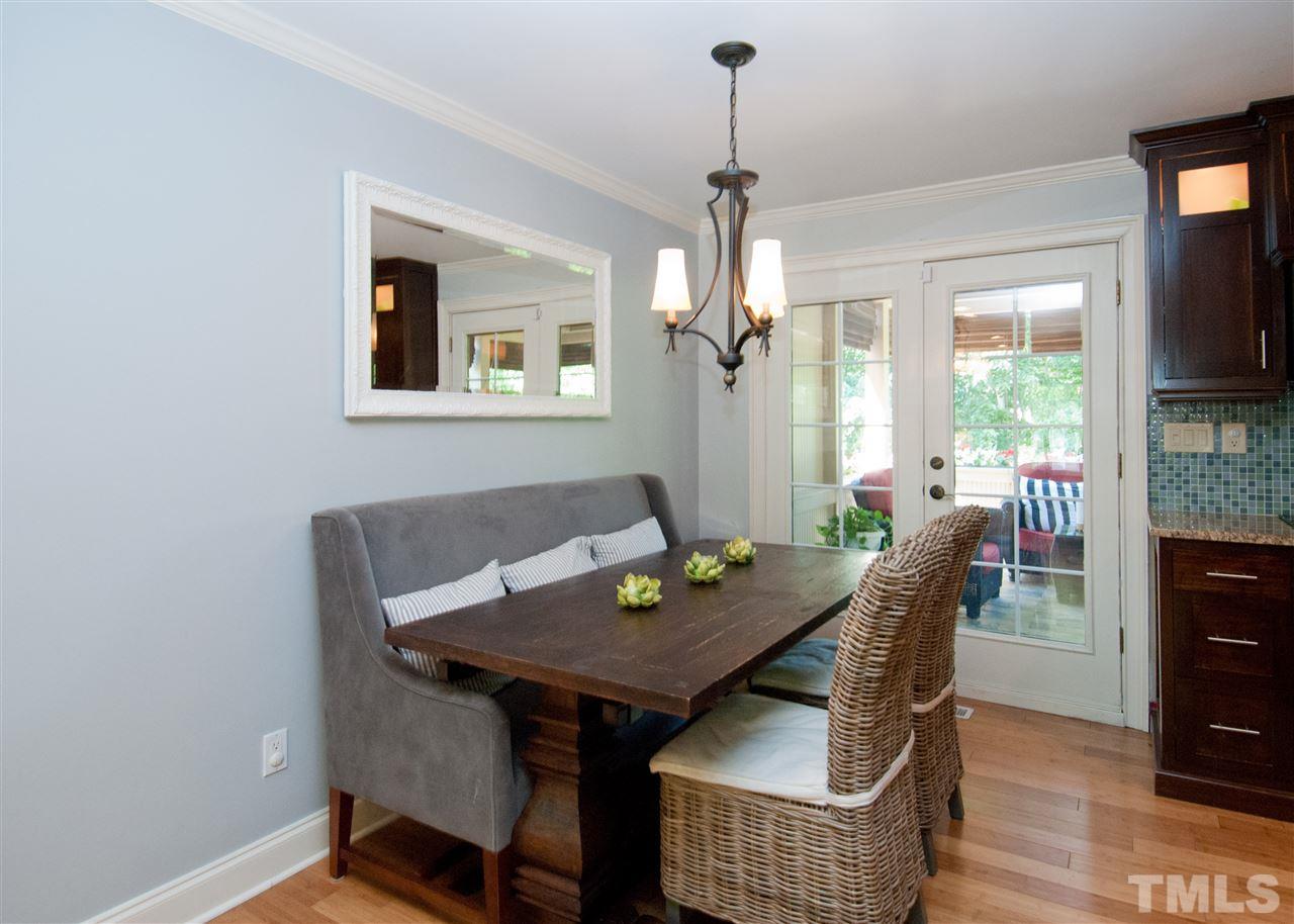 520 Smokeridge Lane Raleigh, NC 27615 - Photo 10 of 25 a view of a dining room with furniture window and wooden floor