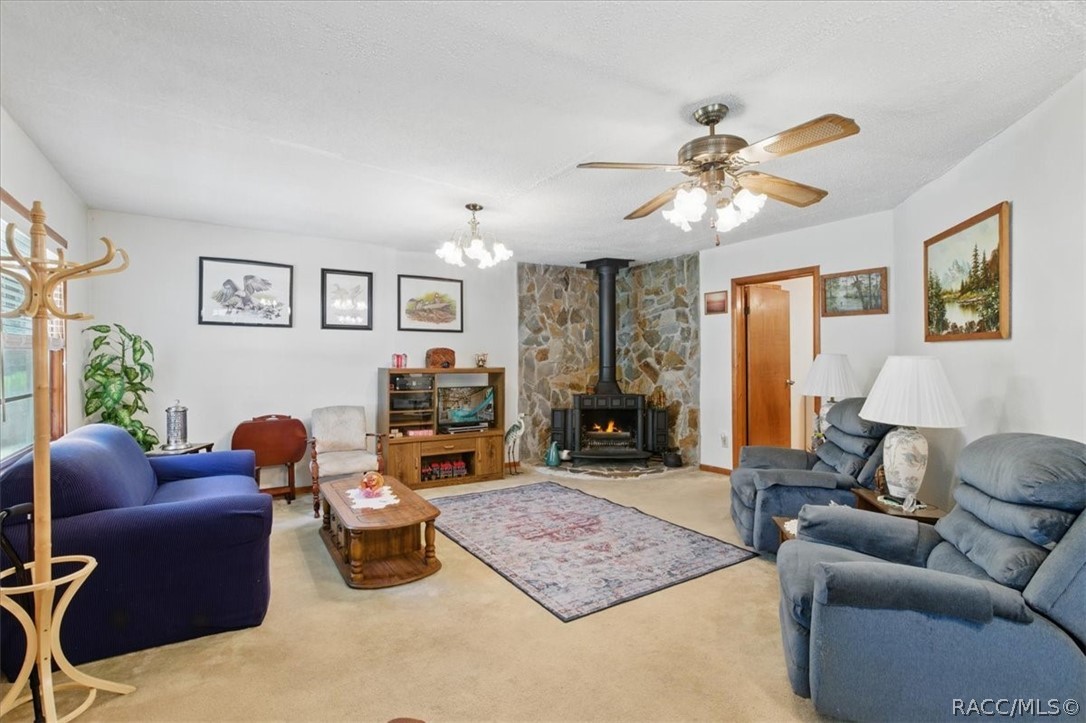 6 62nd Street Yankeetown, FL 34498 - Photo 7 of 55 a living room with furniture ceiling fan and a window