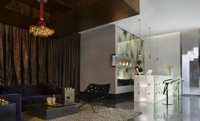 a view of a livingroom with furniture and chandelier