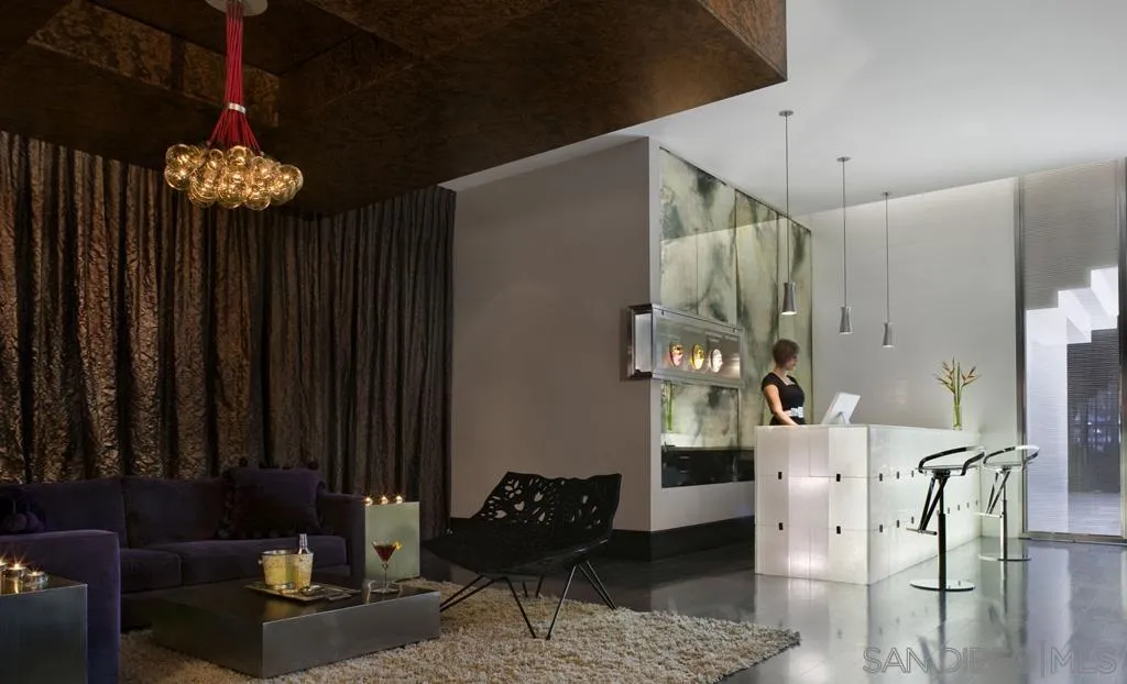 207 Fifth Avenue, Unit 737 San Diego, CA 92101 - Photo 3 of 14 a view of a livingroom with furniture and chandelier