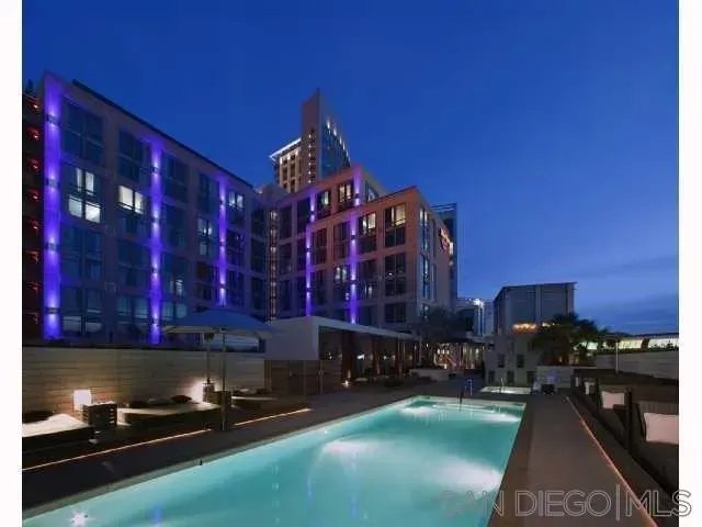 a kitchen with lots of counter top space and stainless steel appliances