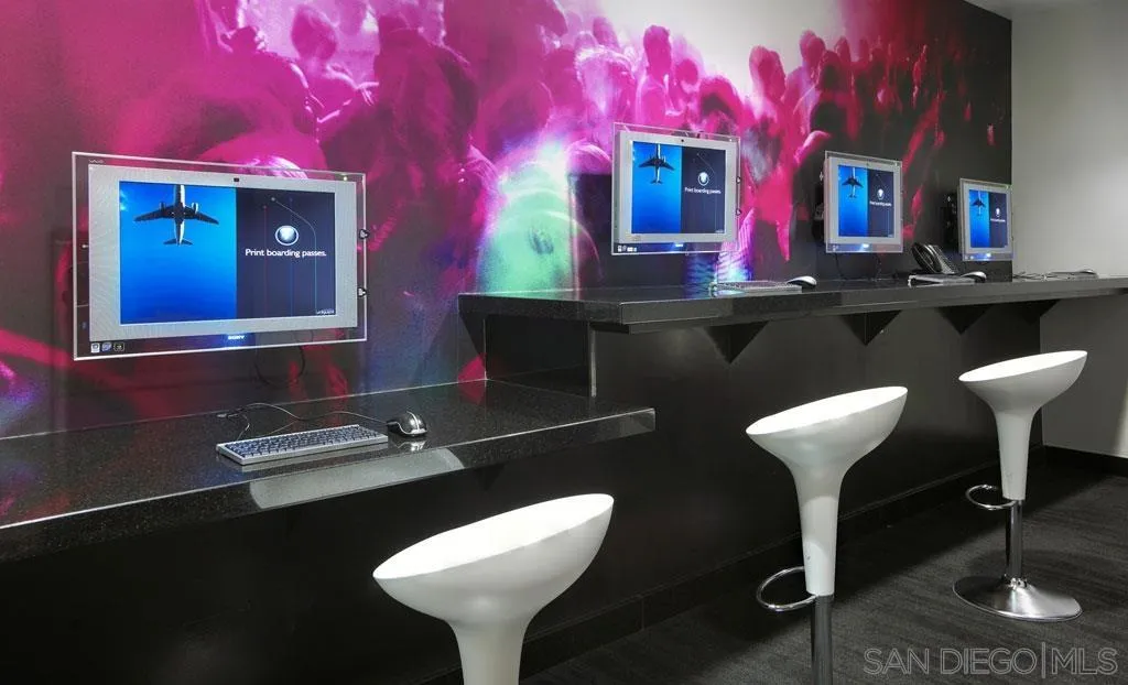 207 Fifth Avenue, Unit 737 San Diego, CA 92101 - Photo 10 of 14 a bathroom with a sink and a mirror