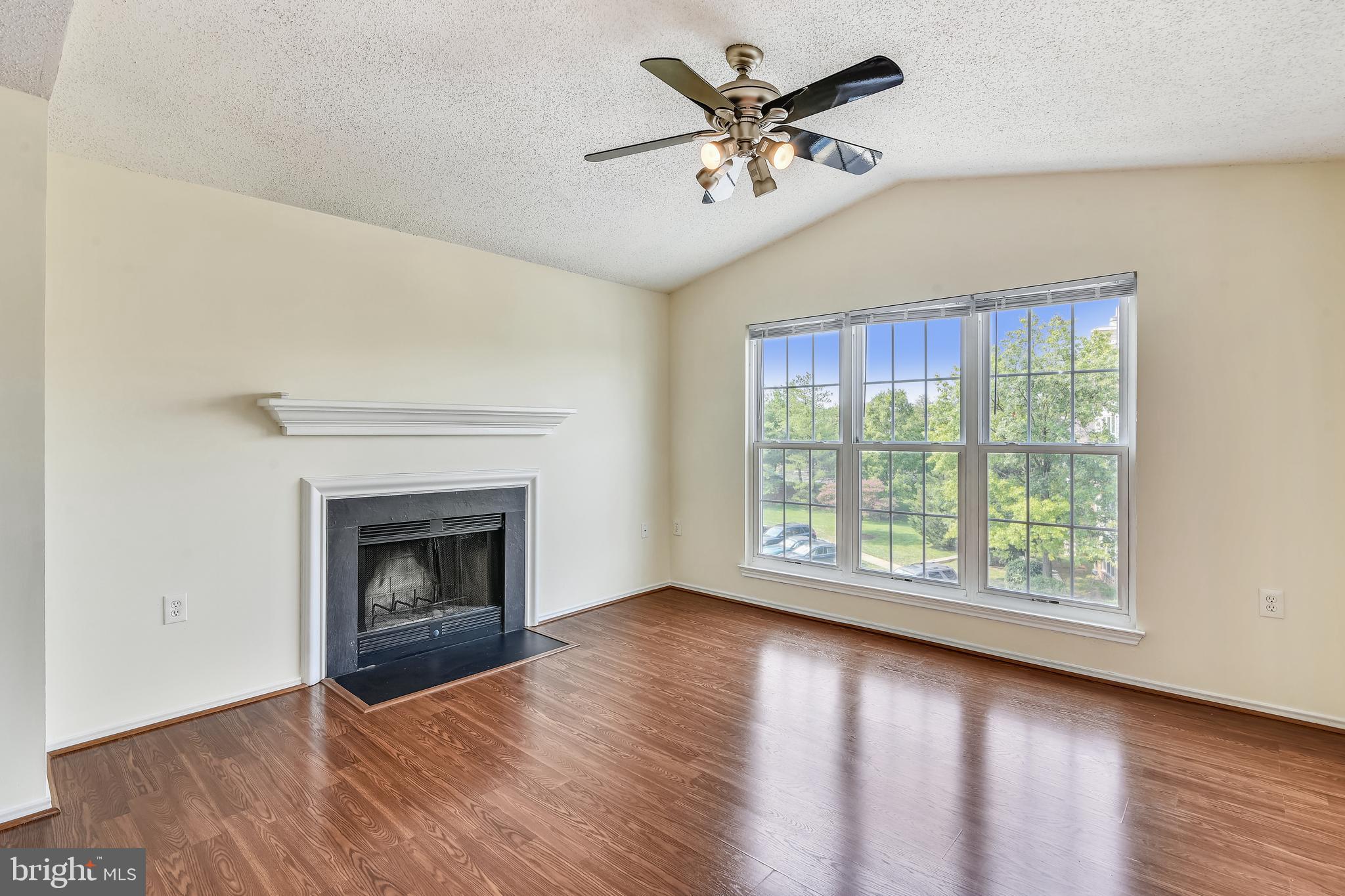21023 Timber Ridge Terrace, Unit 302 Ashburn, VA 20147 - Photo 8 of 16 Light filled spacious living area.