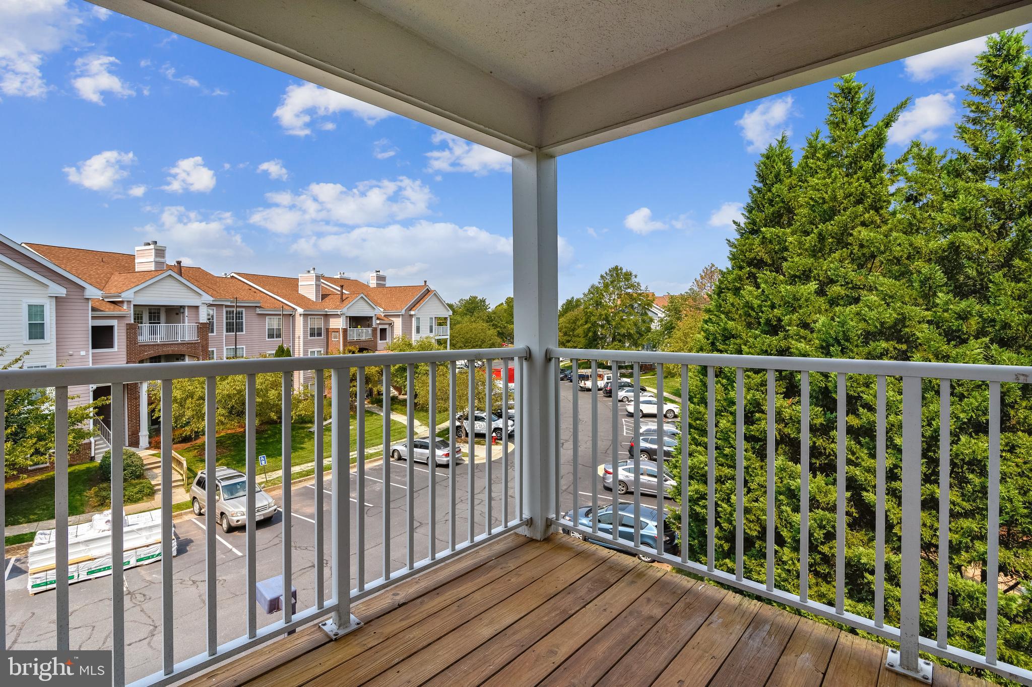 21023 Timber Ridge Terrace, Unit 302 Ashburn, VA 20147 - Photo 9 of 16 Oversized corner balcony perfect for entertaining.