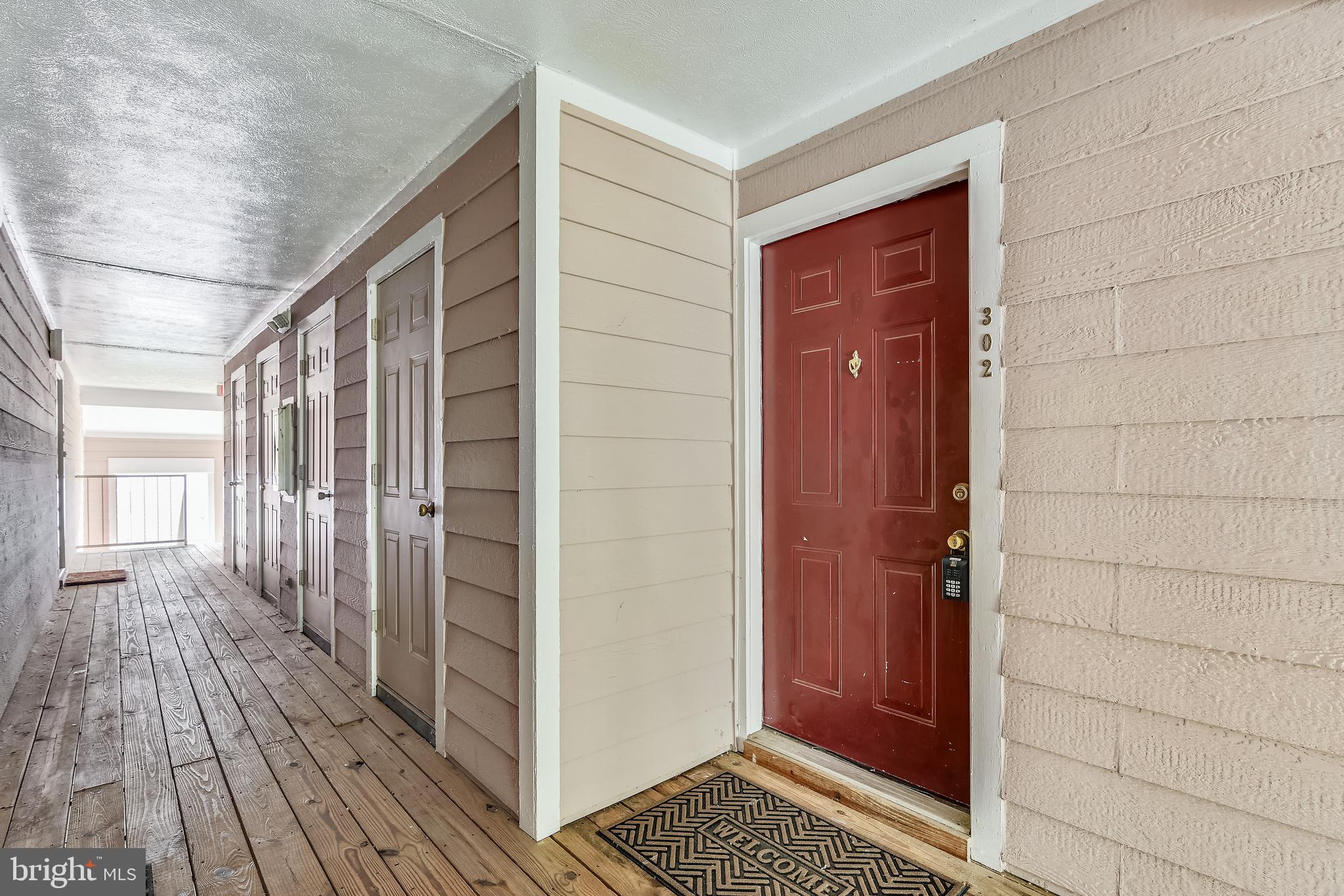 21023 Timber Ridge Terrace, Unit 302 Ashburn, VA 20147 - Photo 10 of 16 Welcome Home!! Exterior storage area to left.
