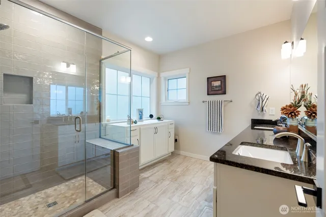 a kitchen that has a sink and a stove in it