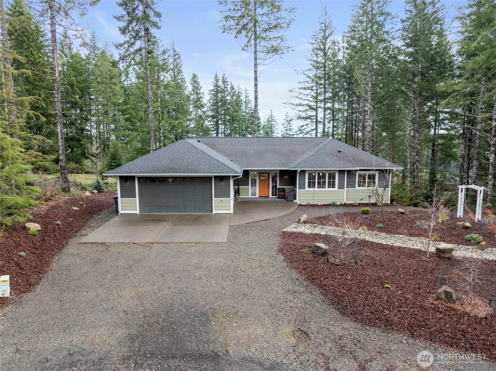71 East Hemlock Court Union, WA 98592 - Photo 2 of 32 a house with trees in the background
