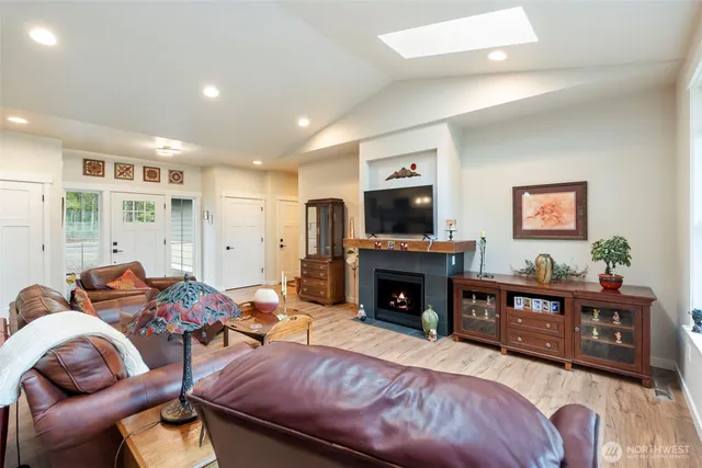 a bedroom with furniture and a fireplace